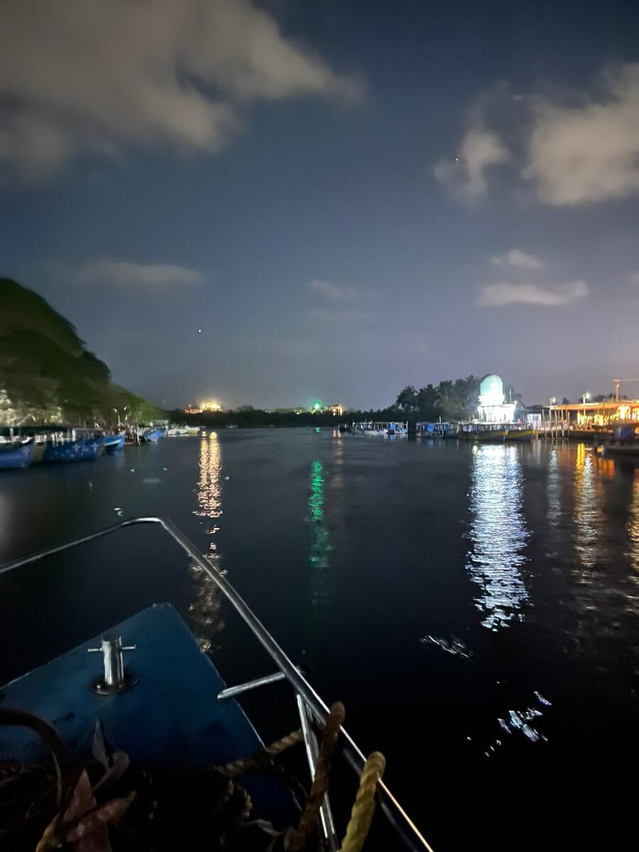 Jetty lights reflected across dark water